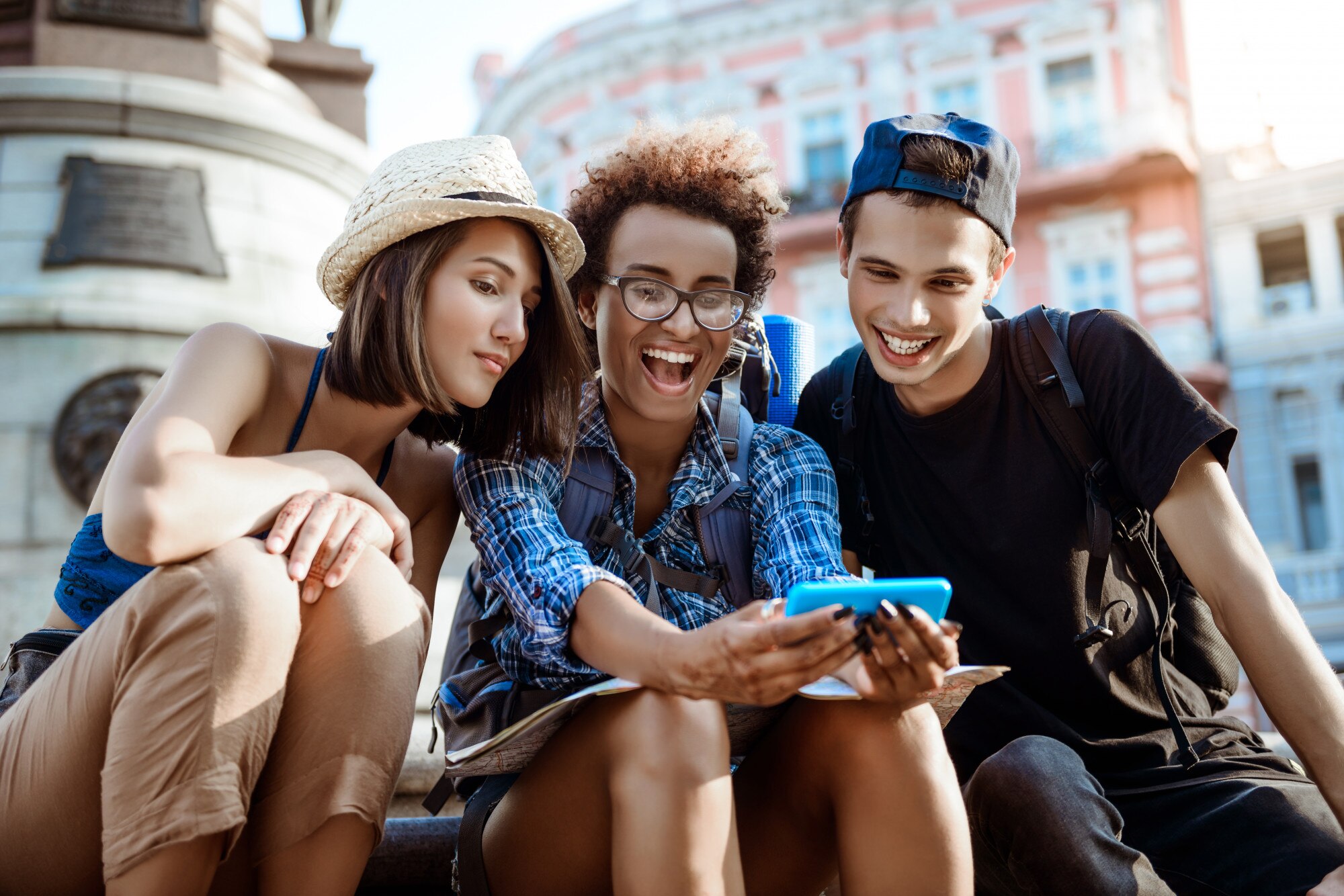 Travellers planning a trip on a phone 1